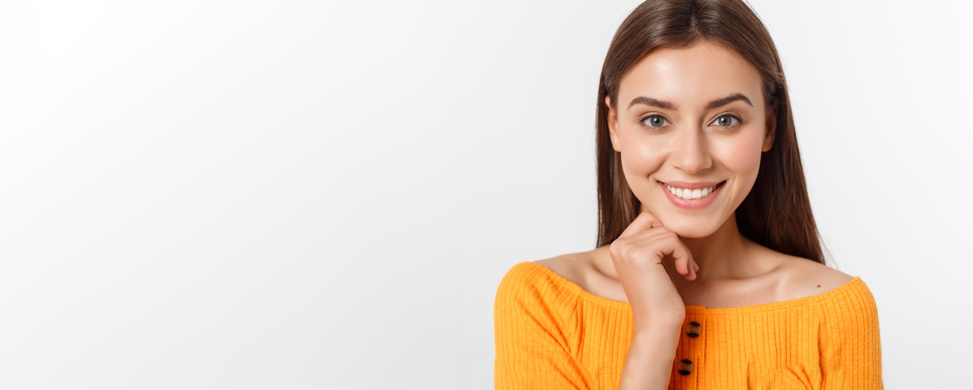 friendly smiling young woman with beatiful face portrait studio shot